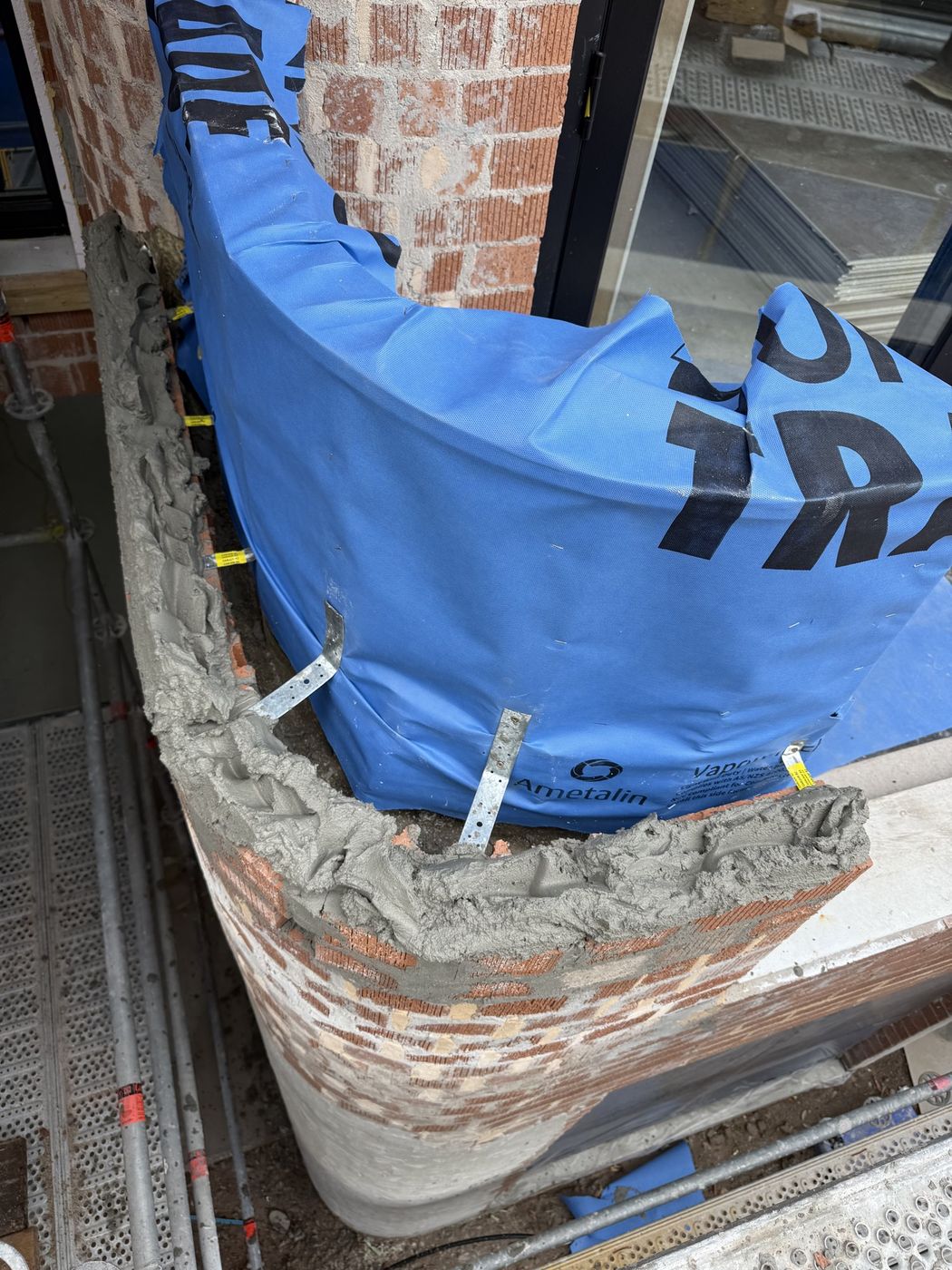 New brickwork protected during construction Mascot