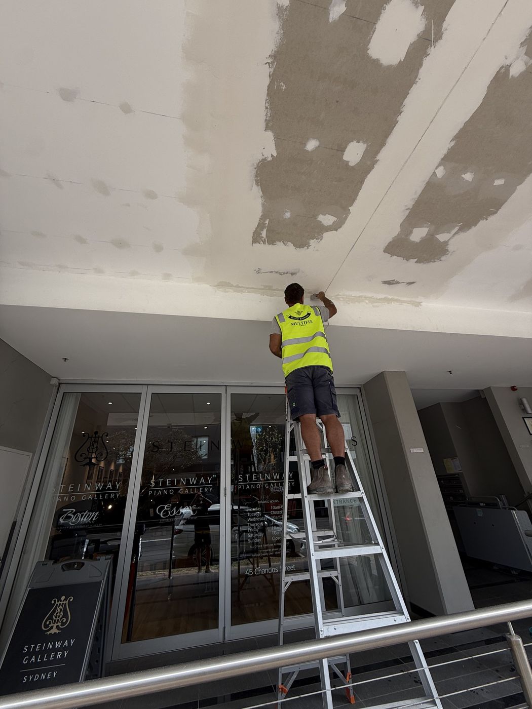 Soffit jointing and painting from ladder