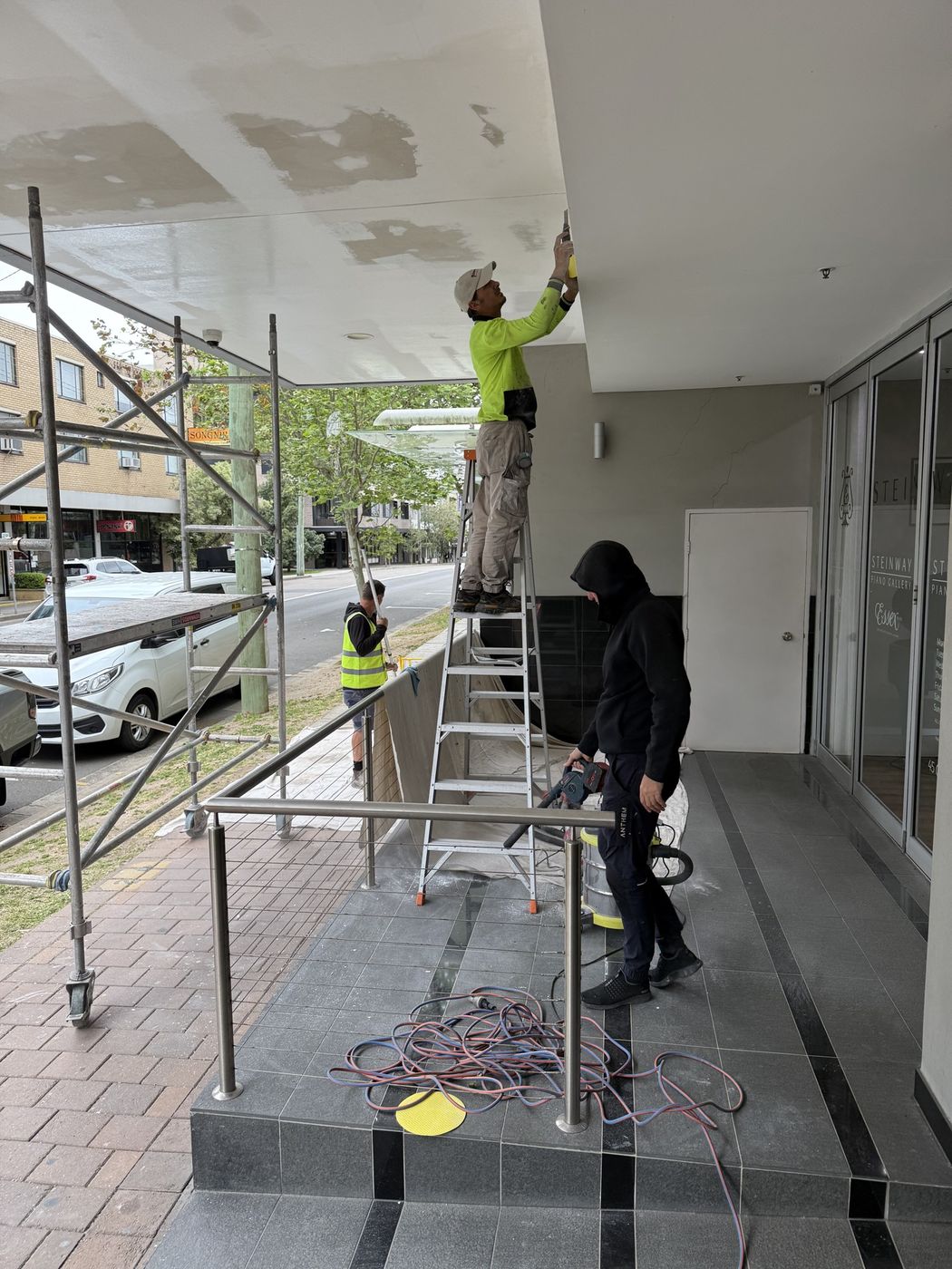 Finishing works to awning soffit from scaffold St Leonards