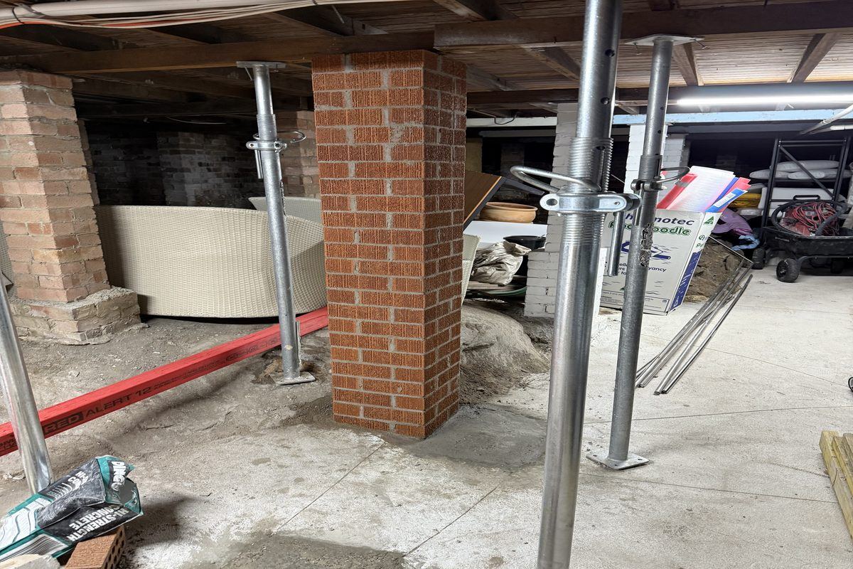 Basement brick pier rebuild with props