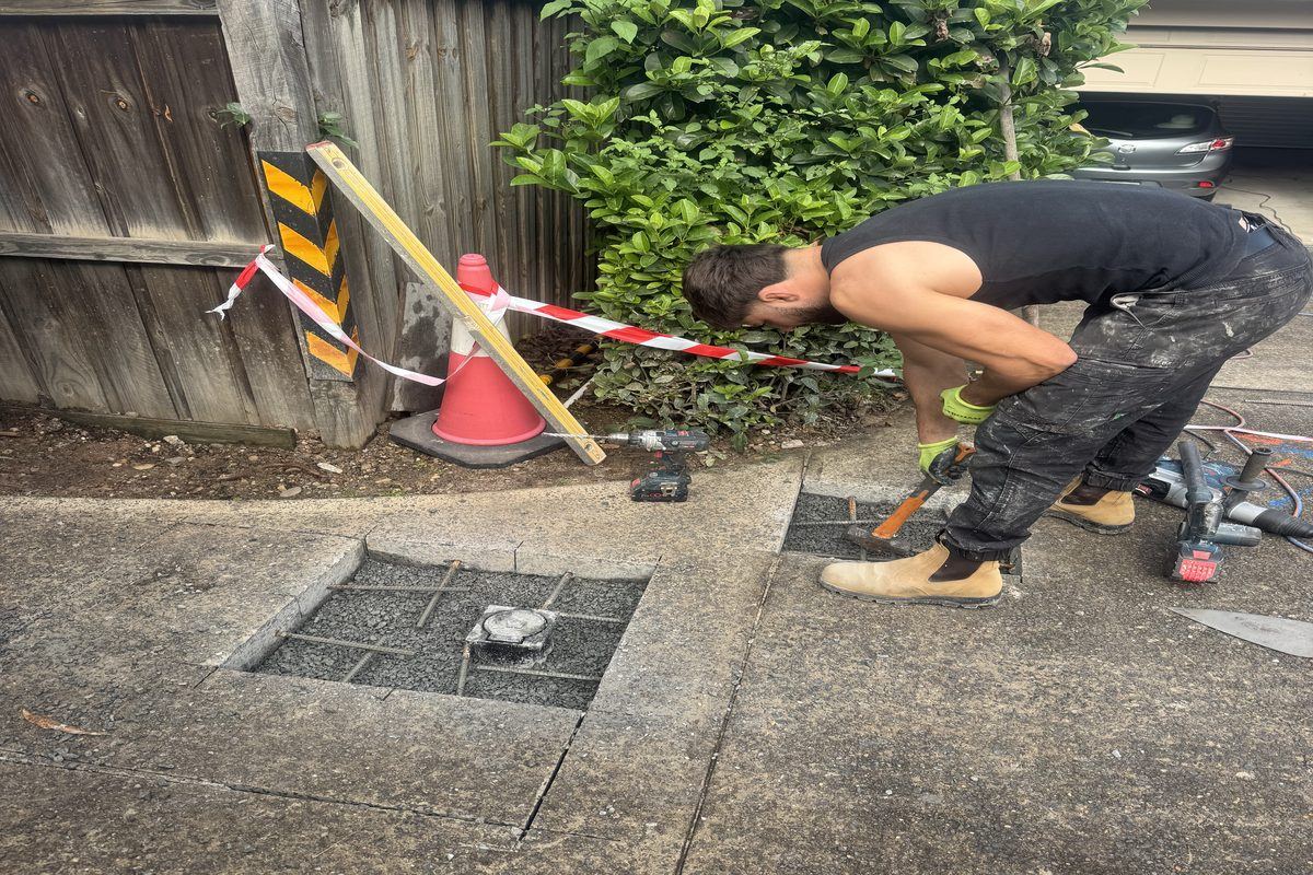 Drainage pits installed in driveway