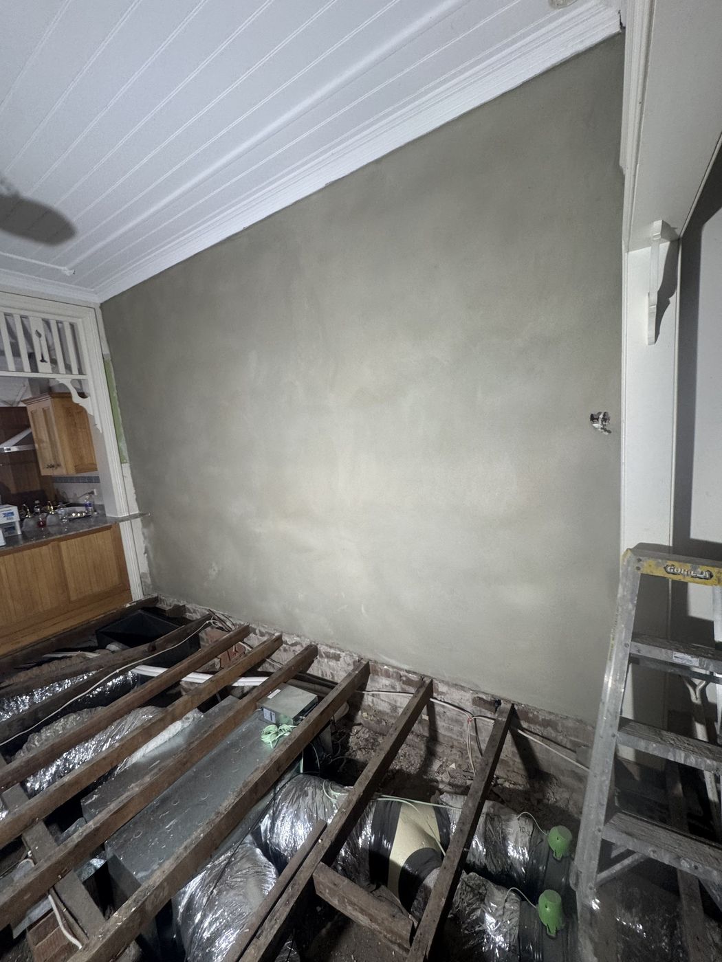 Rendered wall and new floor framing