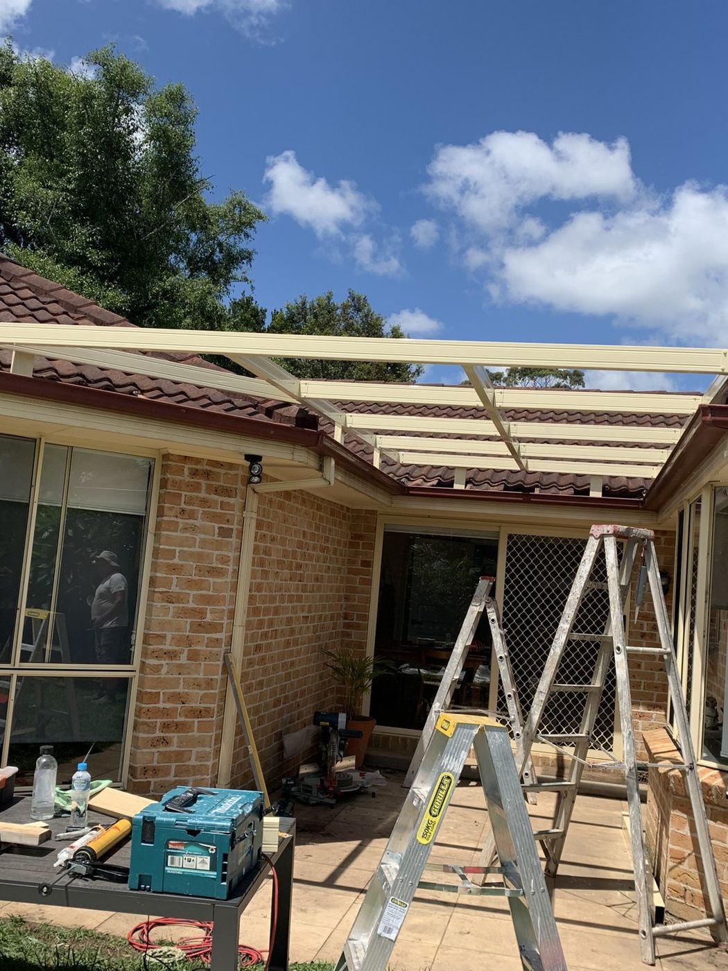 Patio roof framing under way