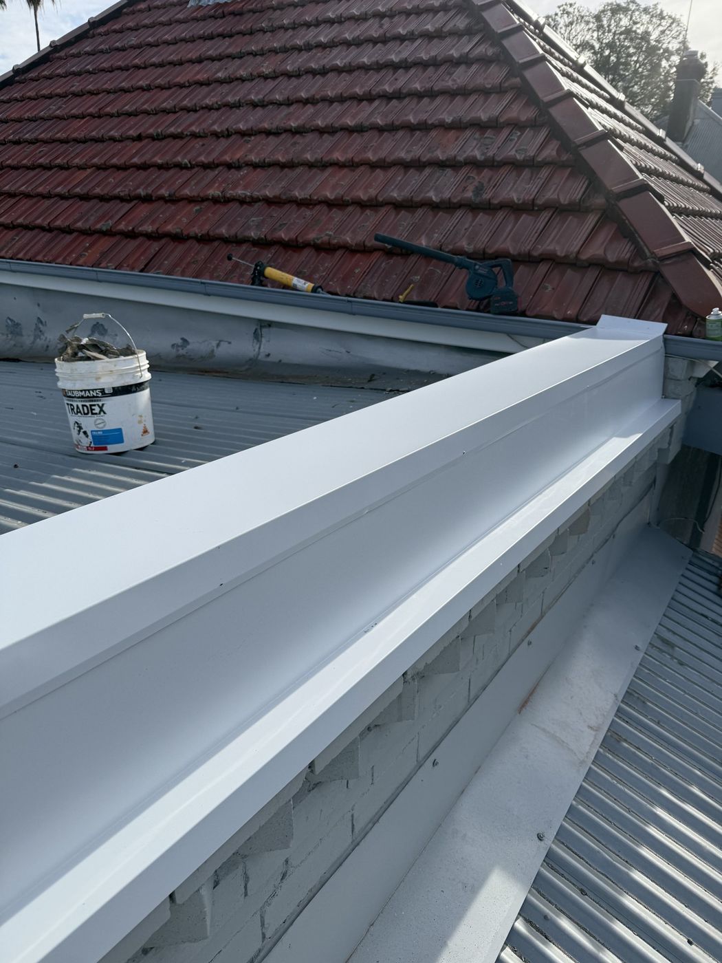 New box gutter installed behind parapet Rozelle