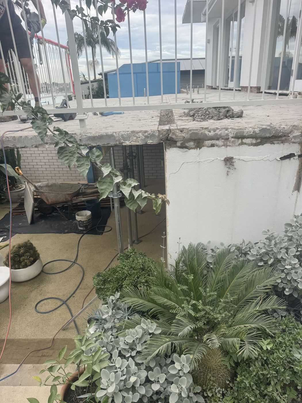 Spalled concrete slab edge before repair