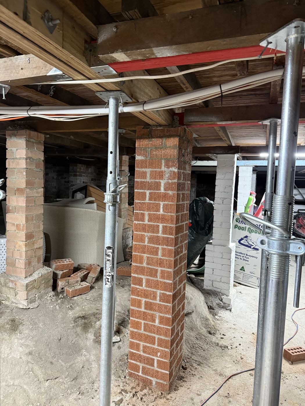 Floor propped and new brick pier built