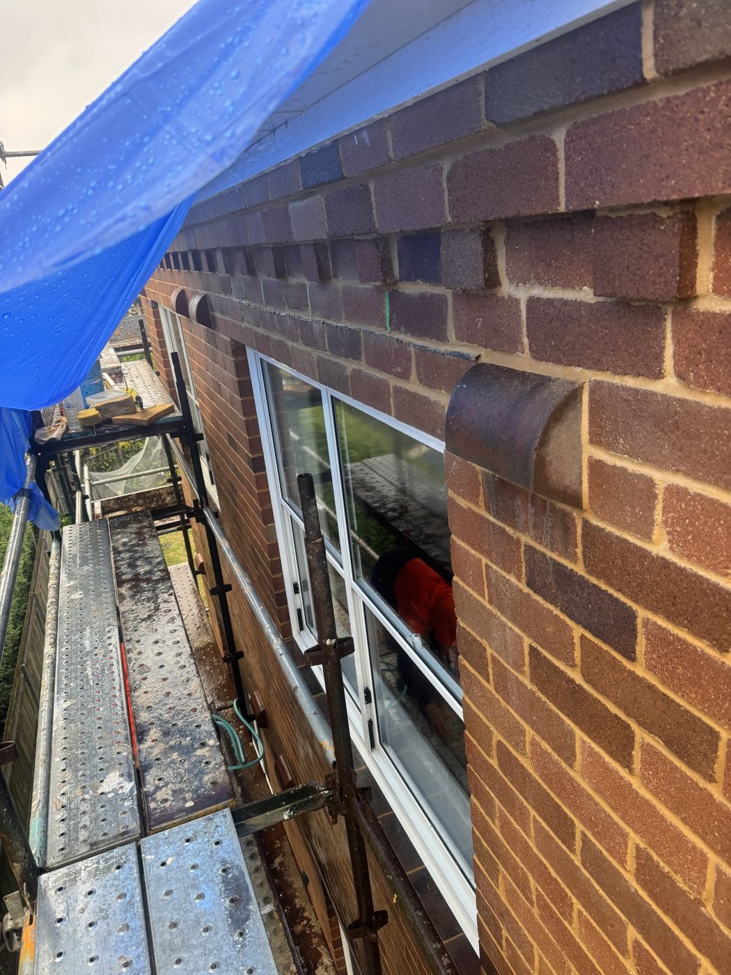 Repointing in progress with weather protection