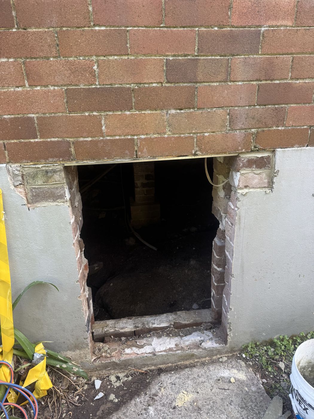 Opening formed beneath dwelling